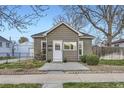 Charming home with gray siding, a white door, and neatly trimmed landscaping adding to its curb appeal at 4344 Chase St, Denver, CO 80212
