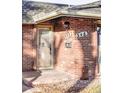 Inviting front entrance with brick facade, modern house numbers, and a classic mailbox at 3483 S Race St, Englewood, CO 80113