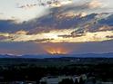 Beautiful sunset view over the mountains and city below at 20249 Terrace View Dr, Parker, CO 80134