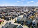 Expansive aerial view of a neighborhood showcasing the community layout and nearby city skyline at 5511 Wabash St, Denver, CO 80238