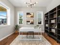 Stylish home office with a modern desk, shelving, and natural light at 5511 Wabash St, Denver, CO 80238