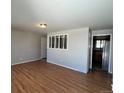 Bright living room featuring hardwood floors and neutral walls at 3236 Carson St, Aurora, CO 80011