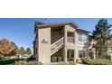 Two-story condo with stone accents and a well-maintained landscape for enhanced curb appeal at 10165 E Carolina Pl # 102, Aurora, CO 80247