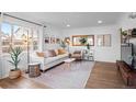 Inviting living room featuring a comfortable sofa, stylish decor, and natural light at 290 Pierce St, Lakewood, CO 80226
