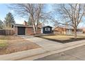 Updated brick ranch home with a large yard and driveway at 12516 E Alaska Ave, Aurora, CO 80012