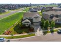 Stunning aerial view of a two-story home featuring lush landscaping and a fenced backyard in a Gathering-friendly neighborhood at 3853 S Malta St, Aurora, CO 80013