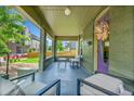 Inviting front porch with seating, perfect for enjoying the outdoors at 2143 S Acoma St, Denver, CO 80223