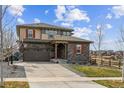 Charming two-story home featuring a two-car garage and a well-maintained front yard at 7301 S Shady Grove Way, Aurora, CO 80016
