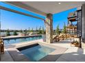 Relaxing hot tub with pool and patio area at 2599 Heron Lakes Pkwy, Berthoud, CO 80513