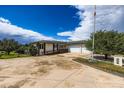 Charming home featuring a ramp leading to the front door, complemented by a spacious driveway and a well-maintained lawn at 16710 Vincent Ave, Monument, CO 80132