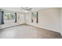 Bright living room with hardwood floors and natural light at 6104 Hudson St, Commerce City, CO 80022