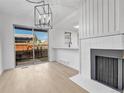 Dining room with a modern chandelier and access to a patio at 264 S Newark Cir, Aurora, CO 80012