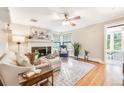Bright living room featuring a fireplace, large windows, and comfortable seating, perfect for relaxation at 1372 Gaylord St # 4, Denver, CO 80206