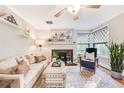 Comfortable living room with a decorative fireplace, stylish furniture, and ample natural light at 1372 Gaylord St # 4, Denver, CO 80206