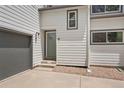 Charming townhome featuring a private garage and a welcoming front entrance with a well-maintained exterior at 202 Hoover Ave, Louisville, CO 80027
