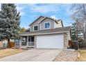 Charming two-story home featuring a stone-accented facade, covered porch, and attached two-car garage at 13124 Tejon St, Westminster, CO 80234