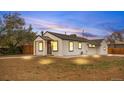 Charming single-story home featuring a cozy front porch, a well-maintained yard, and fresh exterior paint at 2601 W Amherst Ave, Denver, CO 80236