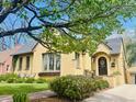 Inviting home with mature trees, well-kept lawn, and a charming front door, perfect for suburban living at 1950 Kearney St, Denver, CO 80220
