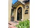 Stylish front door with a decorative awning, address plaque, and vibrant flowers creating a welcoming entrance at 1950 Kearney St, Denver, CO 80220