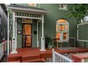 Charming front porch featuring seating, a well-maintained exterior, and colorful accents at 616 W 1St Ave, Denver, CO 80223