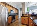 Well-equipped kitchen with stainless steel appliances and granite countertops at 9530 E Florida Ave # 2001, Denver, CO 80247