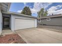 Exterior shot of a two-car garage, providing convenient parking and storage space at 12879 E Oregon Dr, Aurora, CO 80012