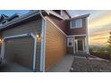Charming home featuring a two-car garage, well-maintained landscaping and a welcoming entrance at 1653 Valley Oak Ct, Castle Rock, CO 80104
