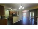 Bright, updated kitchen featuring stainless appliances and a view to the dining room at 1653 Valley Oak Ct, Castle Rock, CO 80104
