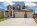 Beautiful two-story home with a well-manicured lawn and a spacious three-car garage at 16341 Clayton St, Thornton, CO 80602