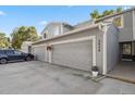 Street view featuring the property's garages with a car parked nearby at 2826 S Lansing Way, Aurora, CO 80014