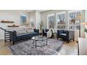 Bright and airy living room with ample natural light and comfortable seating at 3444 Mariposa St, Denver, CO 80211