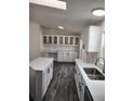 Updated kitchen with stainless steel appliances, ample counter space, and modern cabinetry at 311 Elm St, Lochbuie, CO 80603