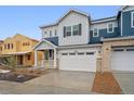 Charming new two-story home with attached two-car garage and inviting front porch at 6566 N Nepal St, Aurora, CO 80019