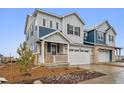 Charming new two-story home with attached two-car garage and cozy front porch at 6566 N Nepal St, Aurora, CO 80019