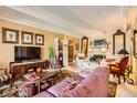 Cozy living room with vintage furniture, patterned rugs, and ample seating at 7865 E Mississippi Ave # 304, Denver, CO 80247