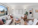 Bright living room with mid-century modern furniture and decor at 8522 Wagner Dr, Westminster, CO 80031