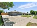 Wide driveway and gray exterior offer ample parking and a modern look at 2714 S Raleigh St, Denver, CO 80236