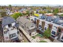 Aerial view of a home with a well-appointed outdoor space including a pergola, fire pit and artificial turf at 1832 W 33Rd Ave, Denver, CO 80211