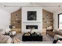 Spacious living room features a modern fireplace and built-in shelving at 3120 Braun Ct, Golden, CO 80401