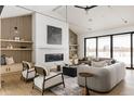 Open living space with large windows, fireplace, and stylish furniture at 3120 Braun Ct, Golden, CO 80401
