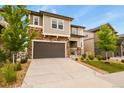 Charming two-story home with a stone facade, attached garage, and well-maintained front yard at 2549 Loon Cir, Castle Rock, CO 80104