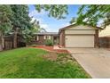 Ranch-style home with brick exterior and a well-kept lawn at 15104 E Utah Pl, Aurora, CO 80012