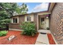 The house features a brick facade and a tidy, landscaped entrance at 15104 E Utah Pl, Aurora, CO 80012