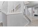 Bright hallway with a staircase and access to a mudroom area at 2805 Masters Ln, Castle Rock, CO 80104