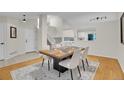 Open-concept dining room with updated fixtures and lots of natural light at 1717 Tulip St, Longmont, CO 80501