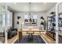 Stylish office space featuring modern decor, a sleek desk, comfortable seating, and ample natural light at 13812 Honey Hush Trl, Parker, CO 80134