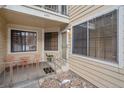 Inviting condo entryway with small patio and seating at 4862 E Kentucky Ave # D, Denver, CO 80246