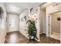 Bright entryway with tile floors and a large plant at 5232 Truckee St, Denver, CO 80249