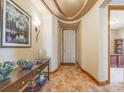 Elegant entryway with tile floors and a curved ceiling at 10730 Pinewalk Way, Highlands Ranch, CO 80130