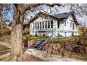 Charming brick home features a landscaped front yard and a welcoming walkway at 1282 S Sherman St, Denver, CO 80210